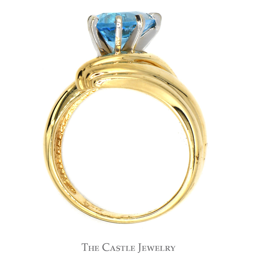 Pear Cut Blue Topaz Ring with Ridged Bypass Sides in 14k Yellow Gold