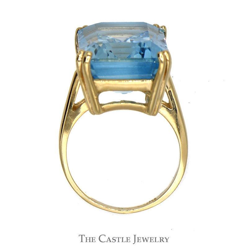 Emerald Cut Blue Topaz Ring in 10k Yellow Gold Cathedral Mounting
