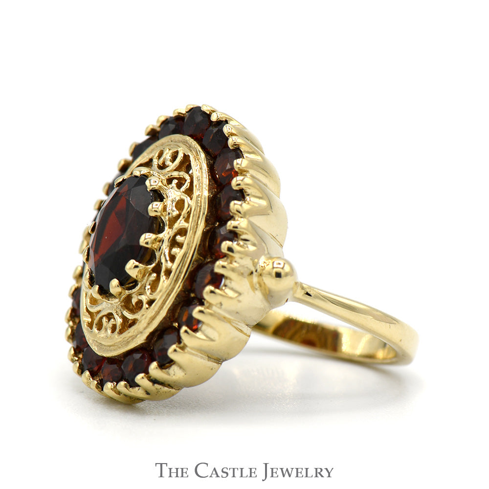 Oval Cut Garnet Shield Ring with Garnet Halo and Open Filigree Design in 10k Yellow Gold