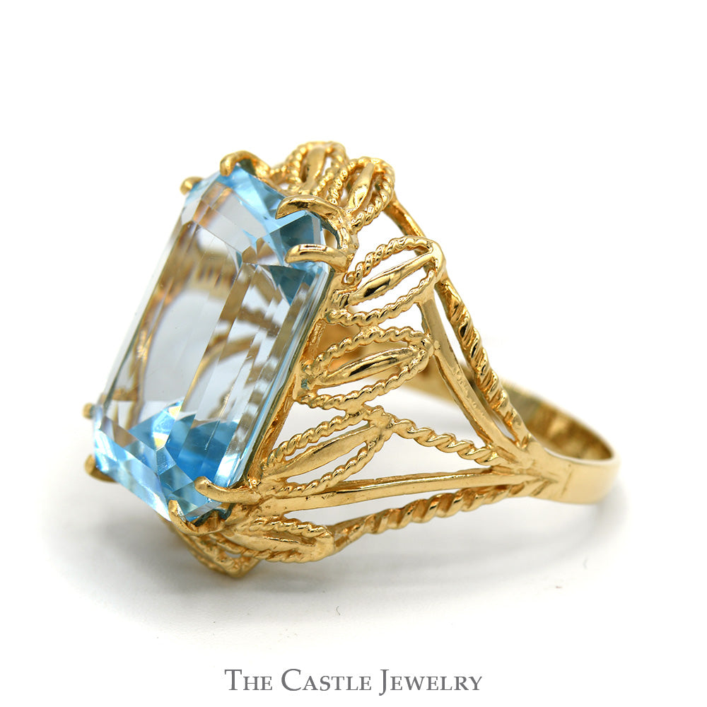 Emerald Cut Blue Topaz Ring with Fancy Leaf Designed Open Setting in 10k Yellow Gold