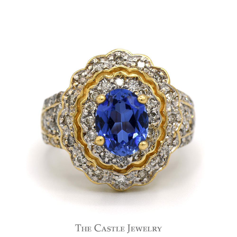 Oval Tanzanite Ring with 3/4cttw Diamond Accented Sides and Halo in 14k Yellow Gold
