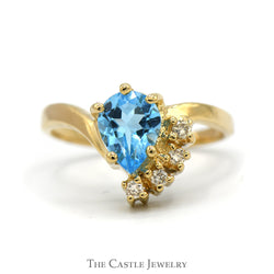 Pear Cut Blue Topaz Ring with Diamond Accents in 14k Yellow Gold