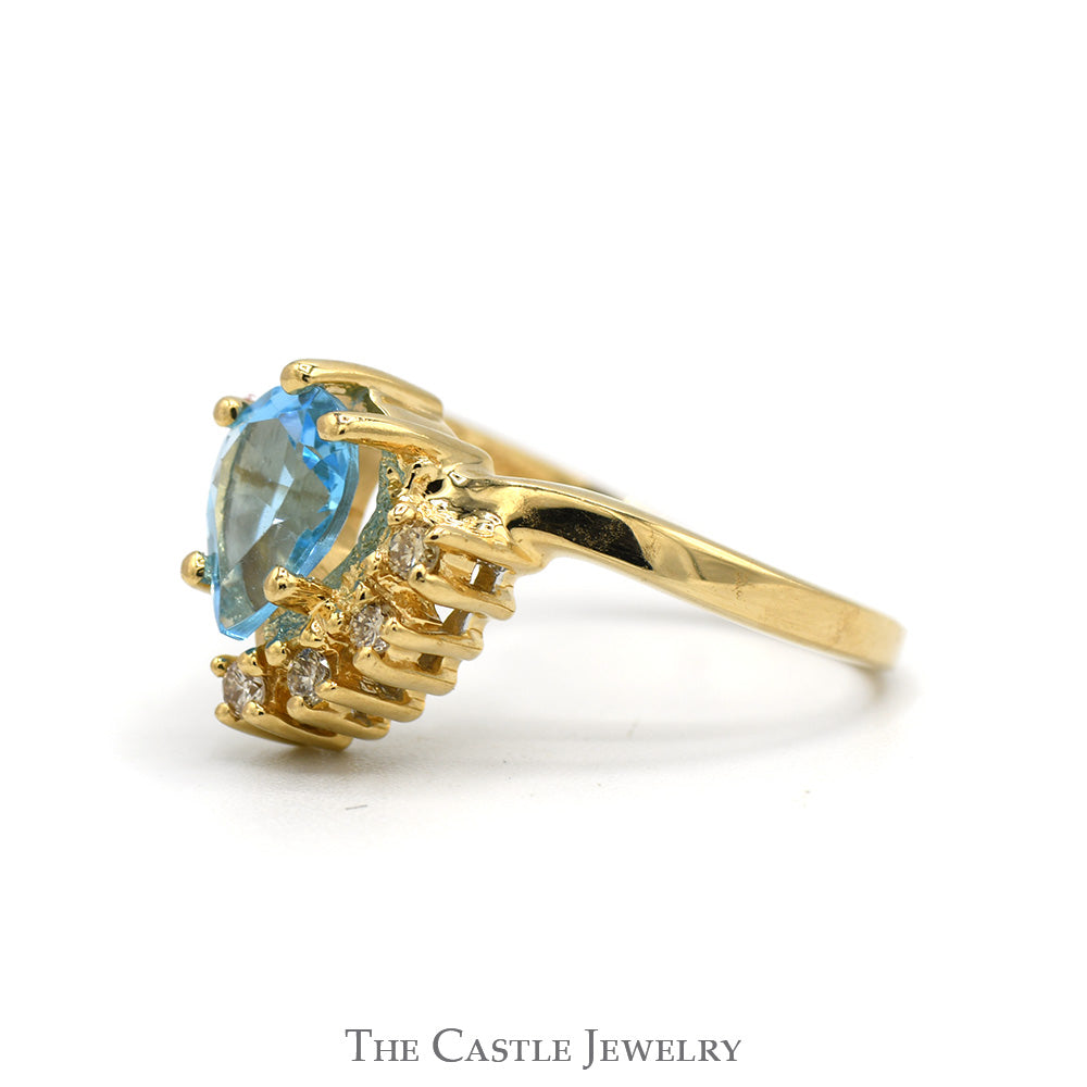 Pear Cut Blue Topaz Ring with Diamond Accents in 14k Yellow Gold