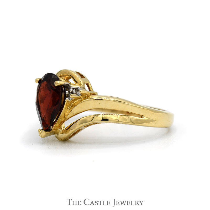 Pear Cut Garnet Ring with Illusion Set Diamond Accents in 10k Yellow Gold