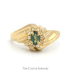 Oval Cut Emerald Ring with Round Diamond Halo and Swirled Ridged Sides in 14k Yellow Gold - Thumbnail 1