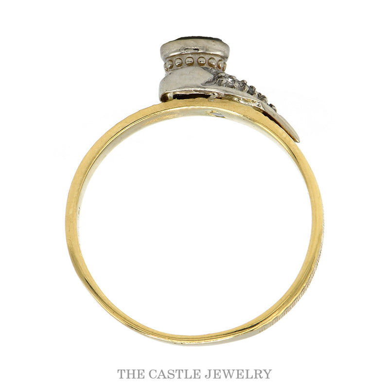 Front-facing view of the bezel set diamond ring with a swept ribbon of illusion set accents in 14k yellow gold