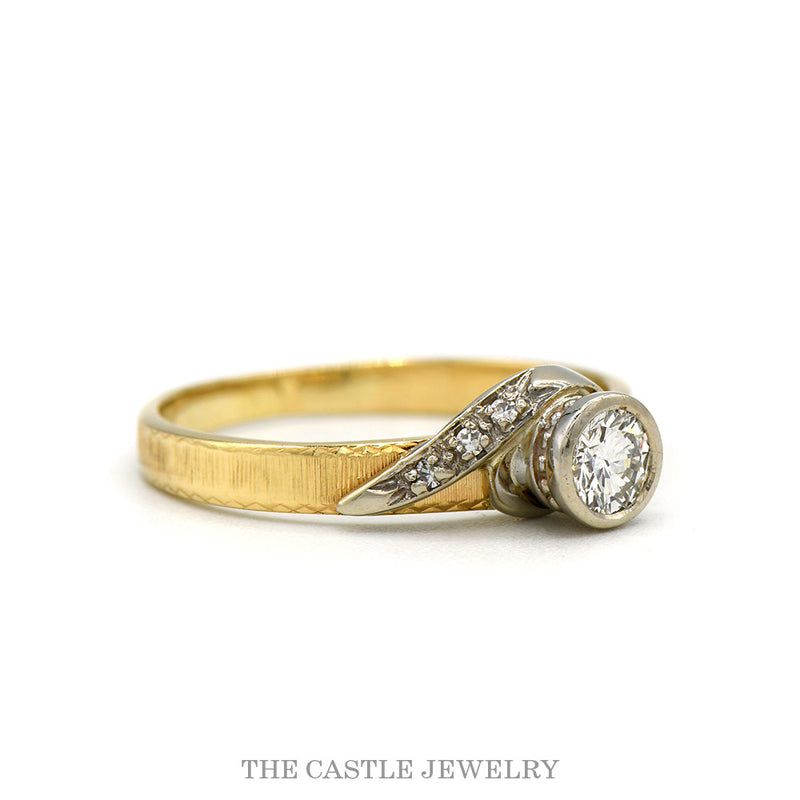 Side profile of the 14k yellow gold bezel set diamond ring