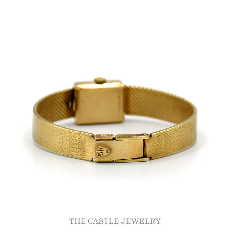 Rolex-signed fold-over clasp on the 14k yellow gold mesh bracelet