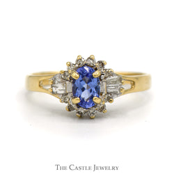 Oval Cut Tanzanite Ring With Diamond Halo And Sides .20 CTTW In 14KT Yellow Gold