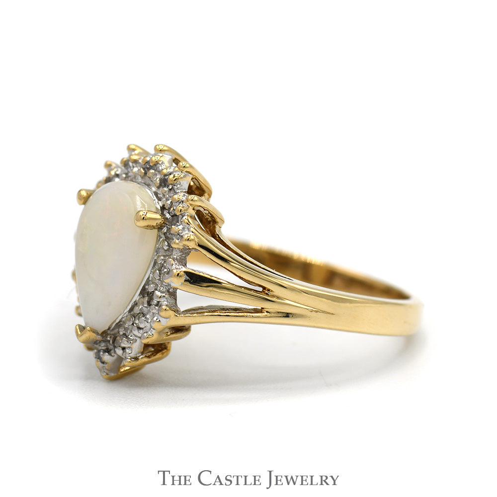 Pear Cut Opal Ring with Diamond Halo and Split Shank Sides in 10k Yellow Gold