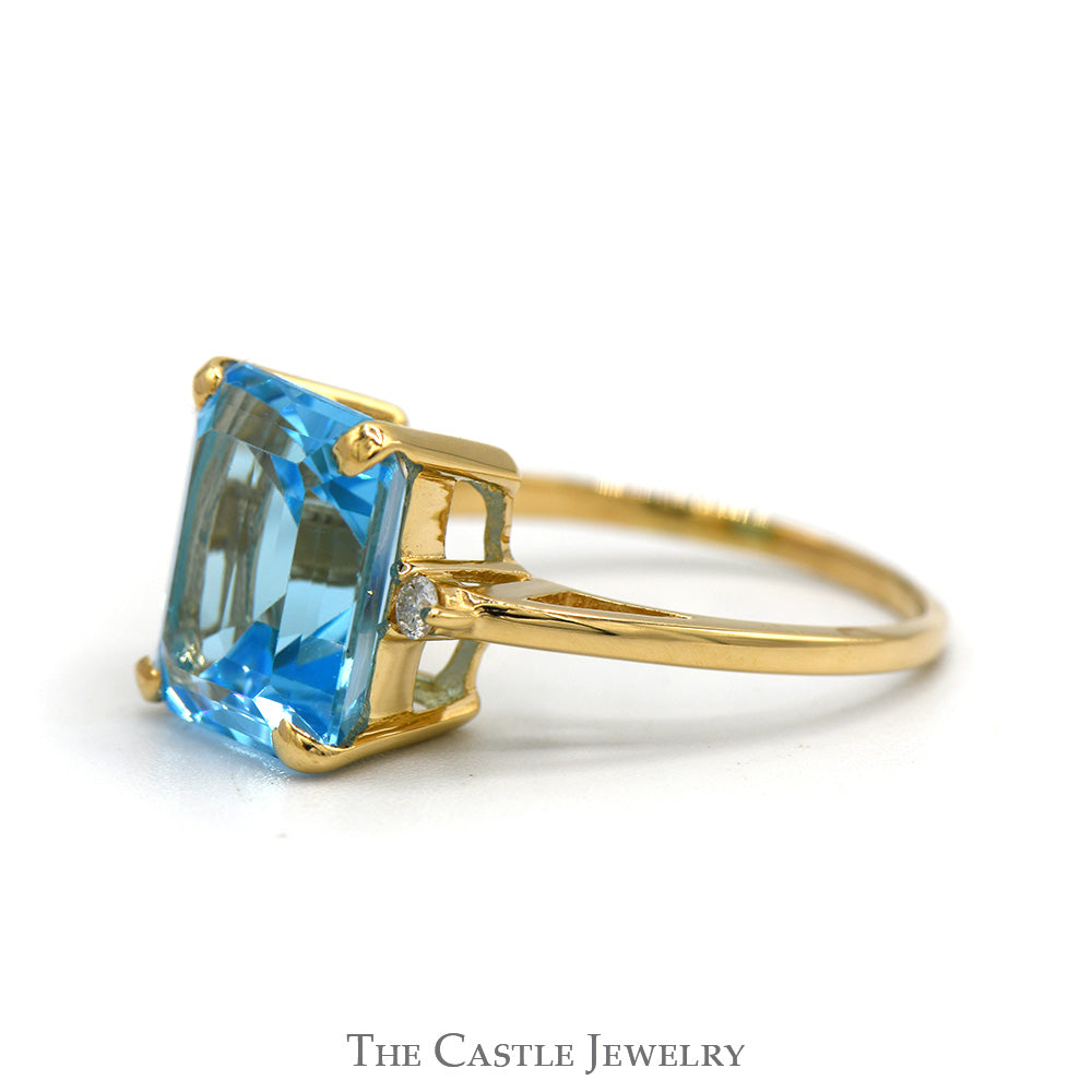 Emerald Cut Blue Topaz Ring with Round Diamond Accented Sides in 14k Yellow Gold