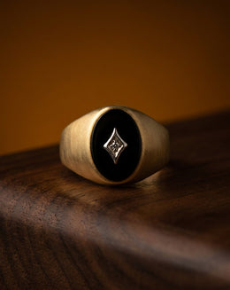 Men's Oval Black Onyx Ring with Diamond Accent in 10k Yellow Gold