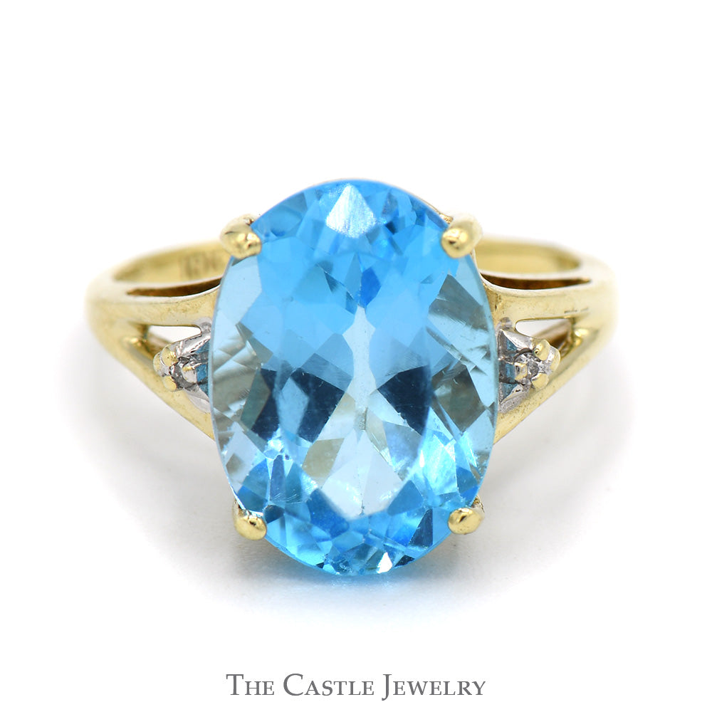 Oval Blue Topaz Ring with Diamond Accents in 10k Yellow Gold Split Shank Setting