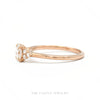 Side profile of the 14k rose gold lab-grown oval diamond ring showing setting height and cluster shoulders - Thumbnail 2
