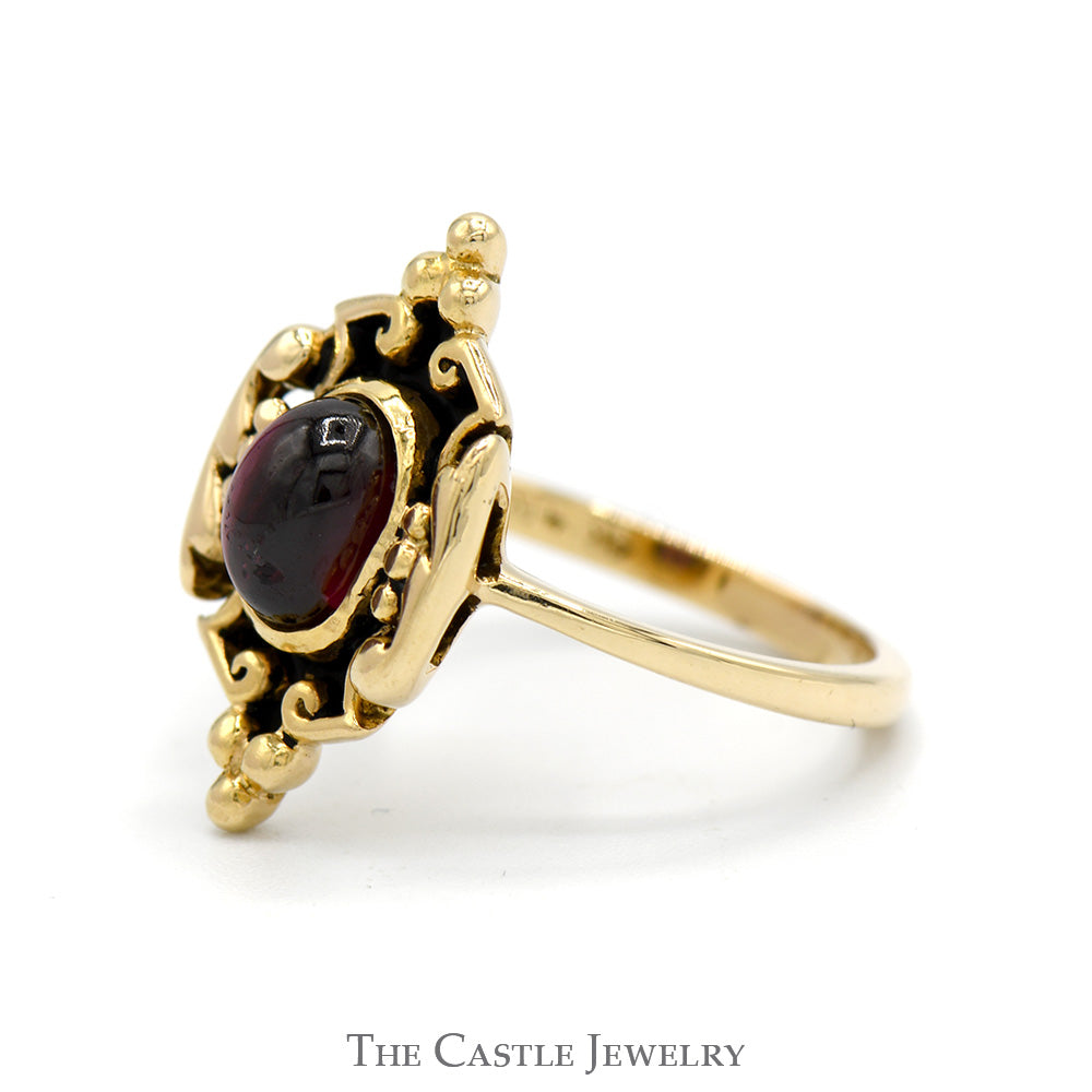 Oval Cabochon Garnet Ring in 14k Yellow Gold Ornate Shield Designed Mounting