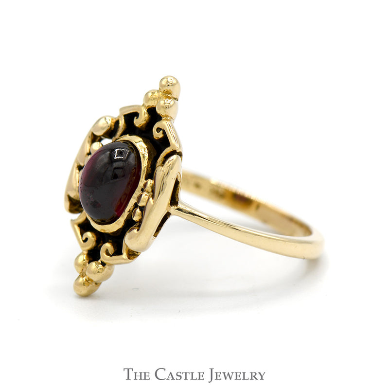 Oval Cabochon Garnet Ring in 14k Yellow Gold Ornate Shield Designed Mounting