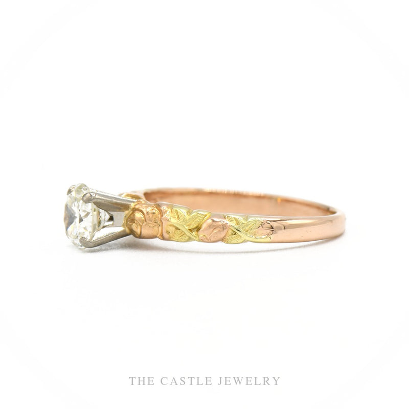 Side profile of the 14k tri-color gold diamond solitaire ring showing setting height and band taper