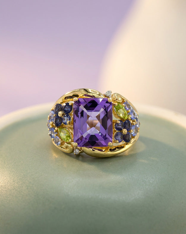 Emerald Cut Amethyst Ring with Multi Gem Flower Design Sides in 14k Yellow Gold