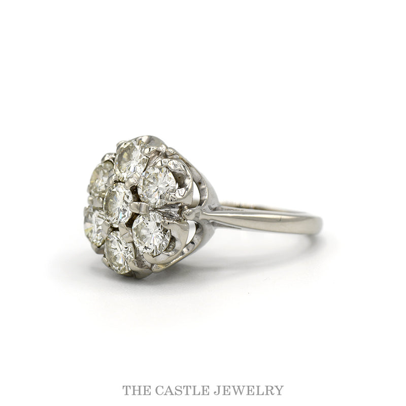 Side profile of the seven diamond cluster ring showing the scalloped gallery and plain shank