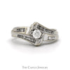 Bypass Design Engagement Ring With .20CT Round Brilliant Cut Center And .30CTTW Of Channel-Set Baguette Cut And Round Diamond Sides In 14KT White Gold - Thumbnail 1