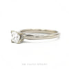Side profile of the 14k white gold princess-cut solitaire showing prong head height and tapered shank - Thumbnail 3