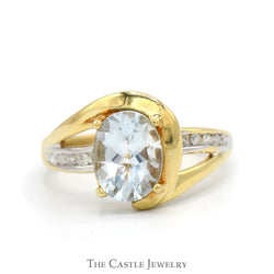Oval Cut Aquamarine Ring with Channel Set Diamond Accented Sides in 10k Yellow Gold Swirled Bypass Mounting