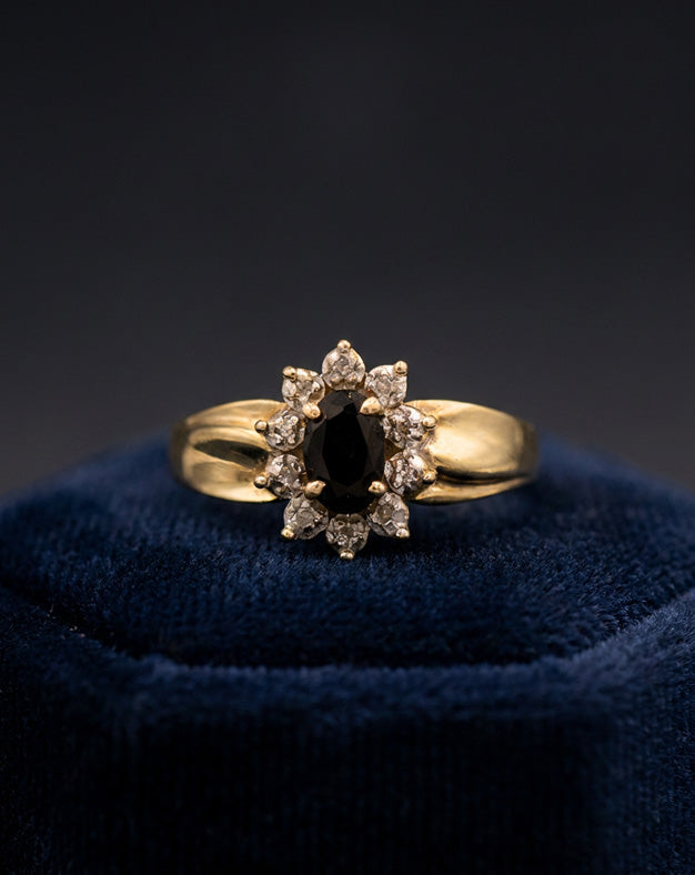 0.85ctw Oval Sapphire and Diamond Halo Ring in 10k Yellow Gold