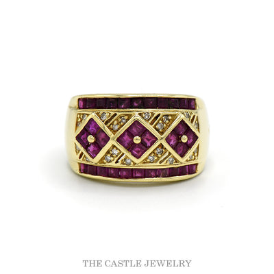 Wide ruby band with three diamond shaped ruby panels, channel set ruby edges and .10cttw diamond accents in 14k yellow gold — top view