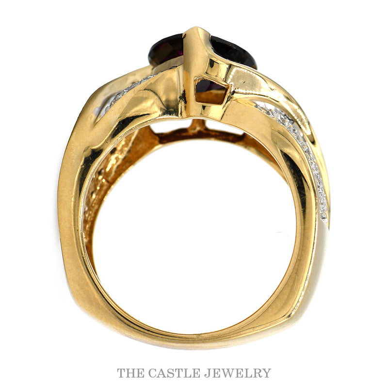 Front-facing view of the 14k yellow gold trillion garnet cocktail ring