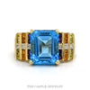 14k yellow gold emerald cut blue topaz ring with multi-gem sides — top view - Thumbnail 1