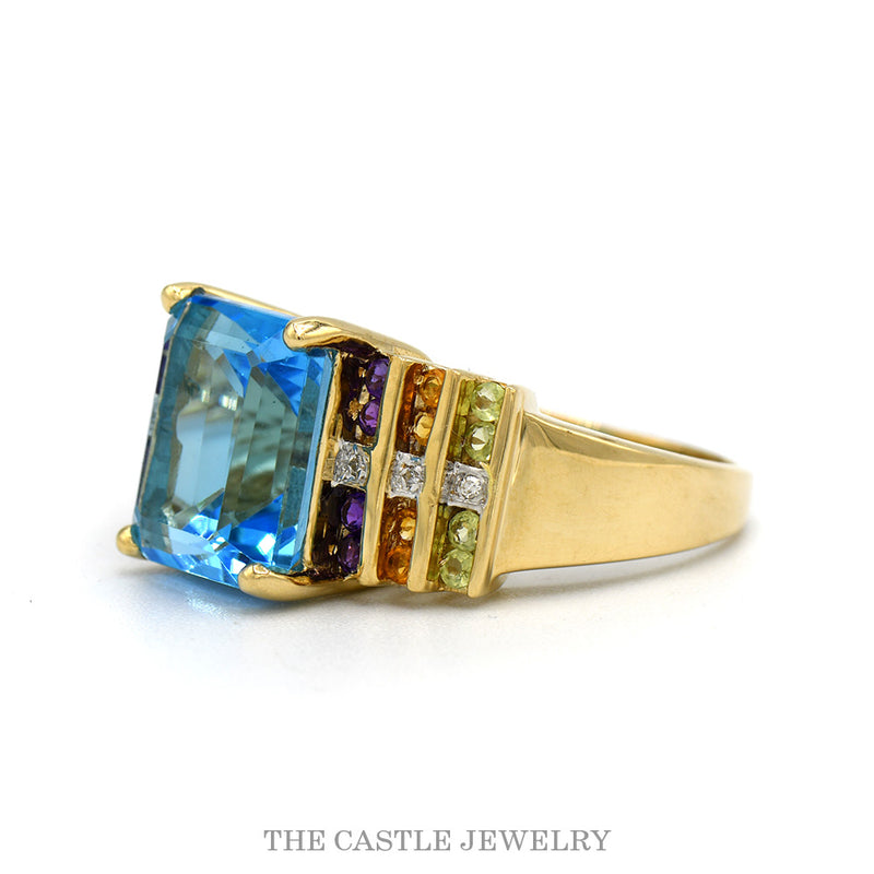 Side profile of the 14k yellow gold blue topaz multi-gem ring