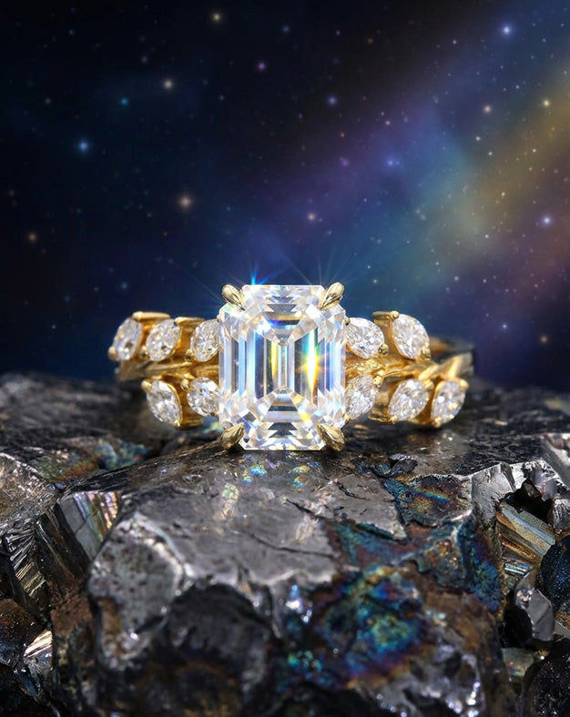 Emerald Cut Moissanite Ring with Pear Cut Moissanite Leaf Designed Accented Sides in 10k Yellow Gold — lifestyle photography