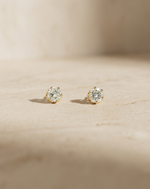 1.5cttw Round Diamond Stud Earrings in 14k Yellow Gold with Screwback Posts — lifestyle photography