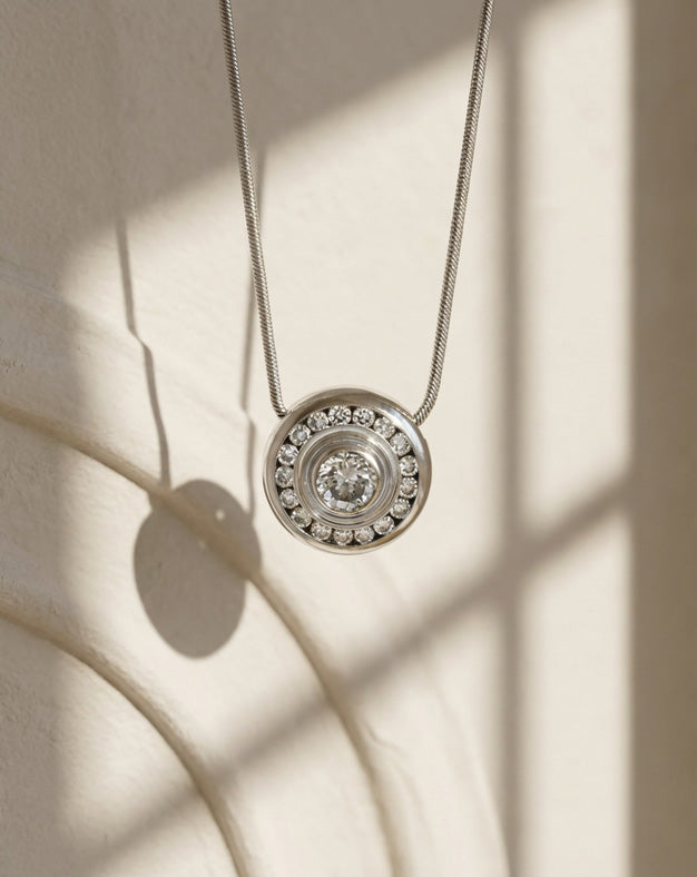 1/2cttw Round Shaped Bezel Set Diamond Cluster Pendant on 20 Inch Snake Chain in 14k White Gold — lifestyle photography