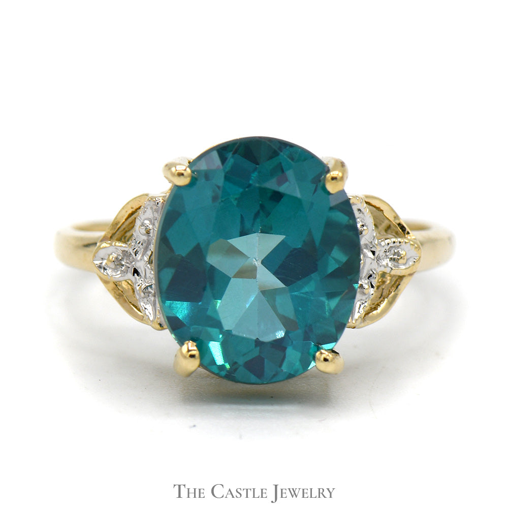 Oval Blue Nile Topaz Ring with Illusion Set Diamond Accents in 10k Yellow Gold