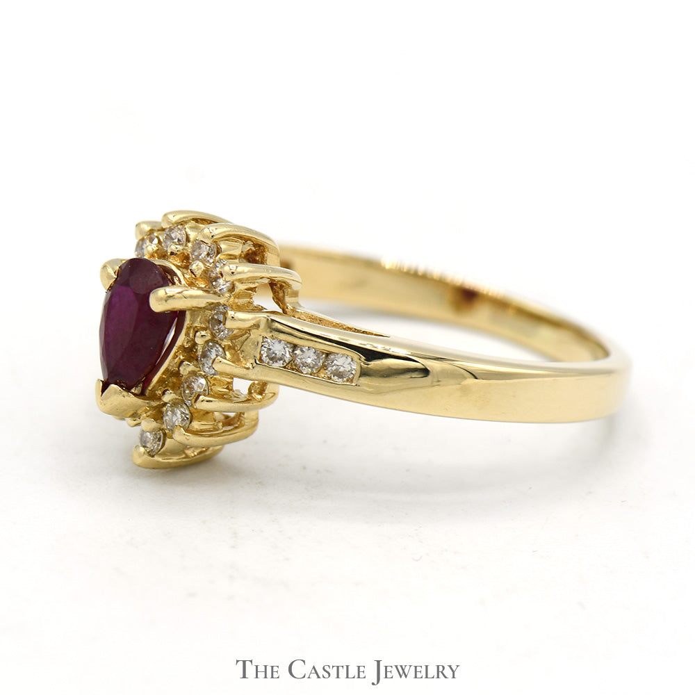 Pear Cut Ruby Ring with Diamond Halo and Channel Set Diamond Accents in 14k Yellow Gold