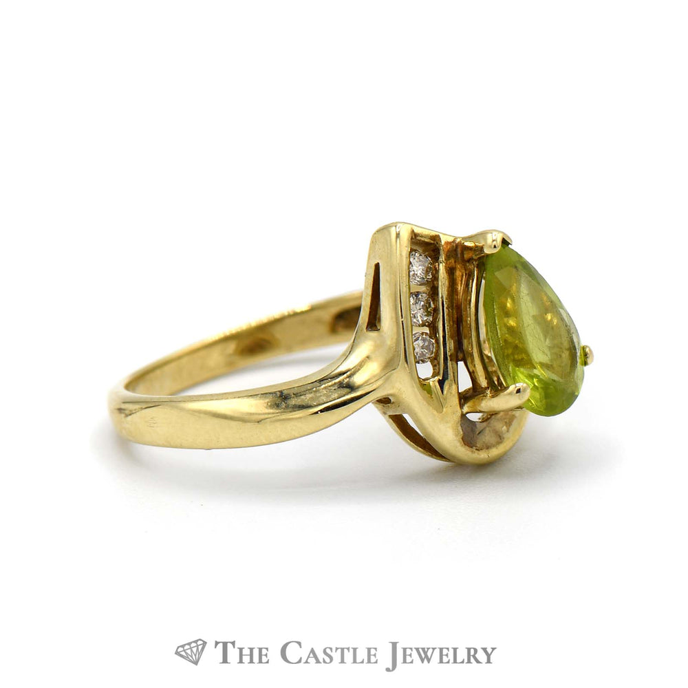 Pear Cut Peridot Ring with 3 Round Diamond Accents in 10k Yellow Gold