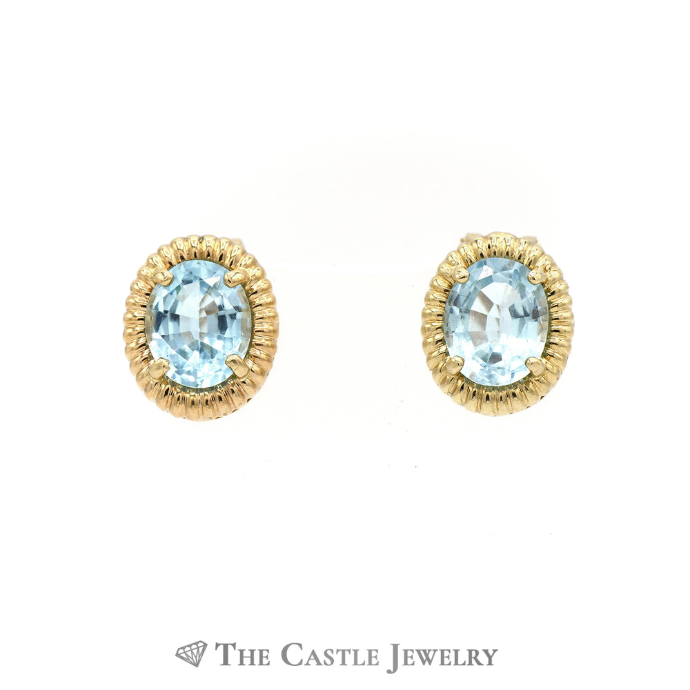 Oval Blue Topaz Earrings with Ribbed Gold Bezel in 14K Yellow Gold